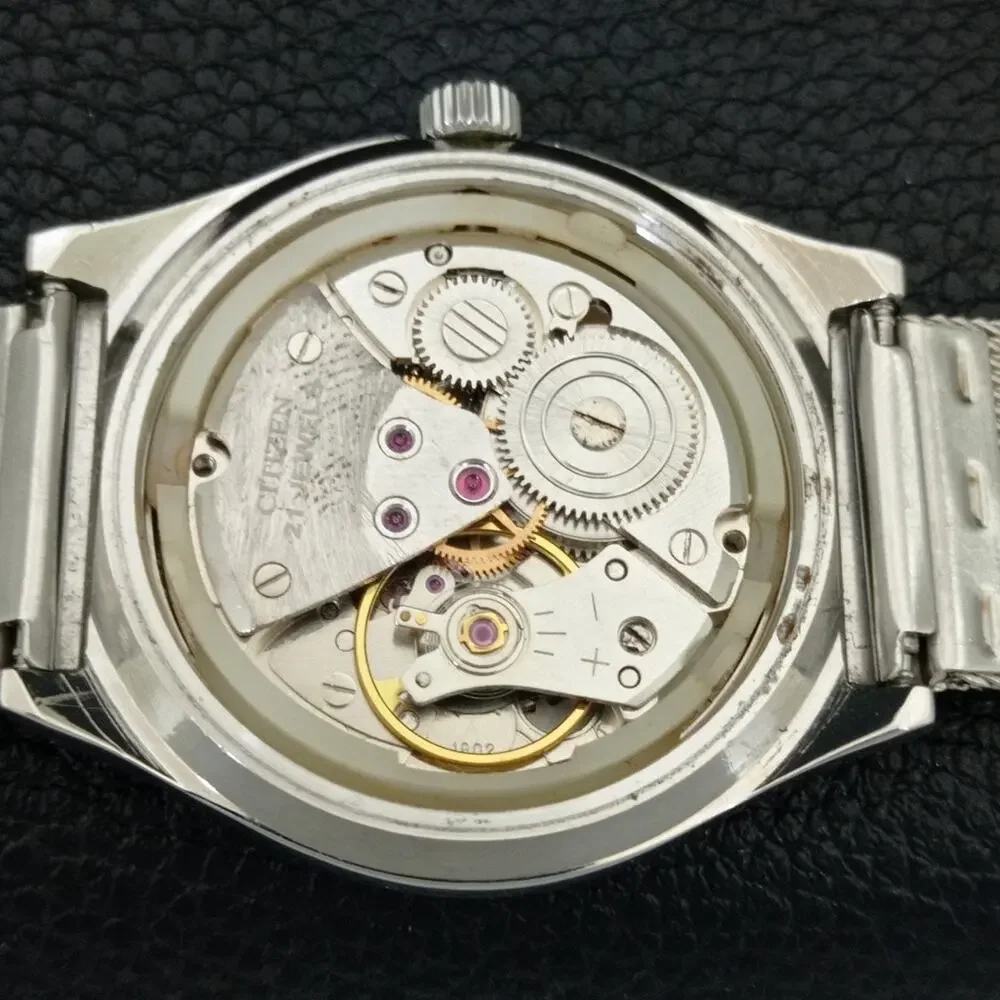 Vintage 1988 Citizen Manual Mens Silver Watch W/daydate & White accents